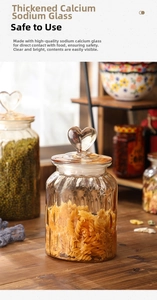 Close-up of amber glass storage jar with heart lid and vertical textured relief details