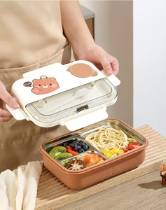 Detail view of multi-compartment 304 stainless steel bento box with cartoon bear lid