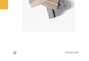 Detail of thick knit beanie with pom-poms in grey, khaki, and cream color options