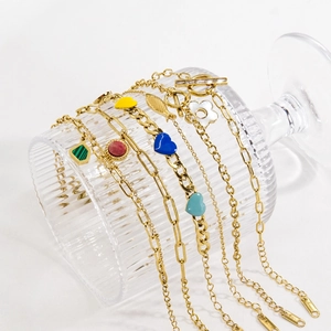 Gold stainless steel link bracelets featuring colorful enamel hearts and natural stone charms