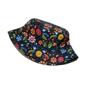 Close-up of a black sun hat with vibrant floral patterns made of soft cotton canvas