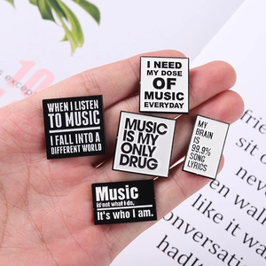 Handheld music theme black and white enamel badges with minimalist quote designs