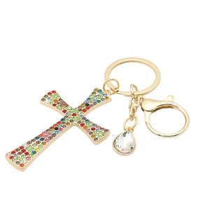 Golden cross keychain with colorful rhinestones and teardrop crystal pendant on white background