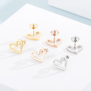 Three pairs of hollow heart stud earrings in gold, silver and rose gold stainless steel