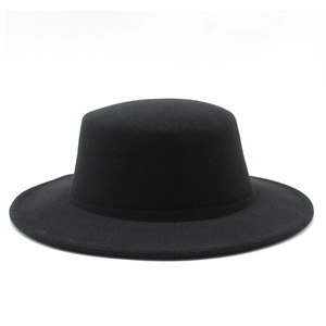 Classic black flat top wide brim wool felt hat for men and women in minimalist studio shot
