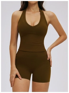 Detail of deep olive green racerback sports bra and high-waist compression shorts