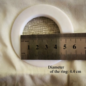 Detail showing ring measurement of velvet curtain with 4.4 cm inner diameter