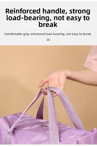 Detail of durable purple oxford fabric travel bag with reinforced webbing handle