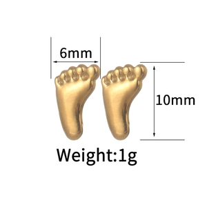 Detail view of gold-tone foot-shaped earrings showing 6mm by 10mm size and 1g weight