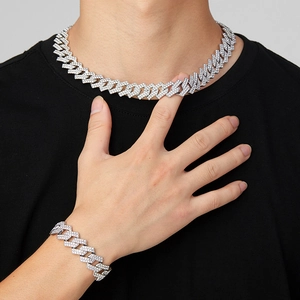 Close-up of hip hop silver Cuban link chain necklace and bracelet set with rhinestones
