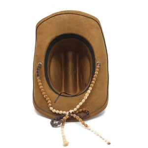 Brown faux suede cowboy hat with ethnic beaded band and saddle crown in a top view