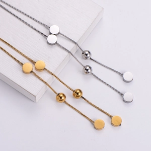 Elegant gold and silver double-layered bead necklaces with polished disc pendants