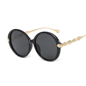 Fashion oversized round black sunglasses with golden leaf-patterned metal temples