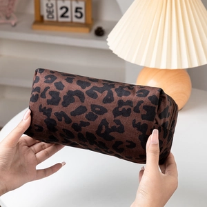 Detailed view of the leopard print travel makeup bag with a secure zipper closure