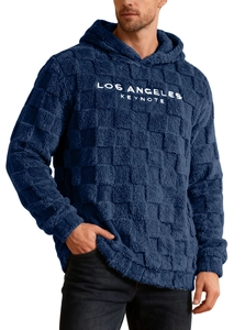 Detail of navy blue sherpa fleece texture with checkered embossing and chest embroidery
