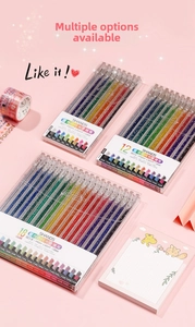 Macro shot of 1.0mm glitter gel pens set for journaling on a pink creative background