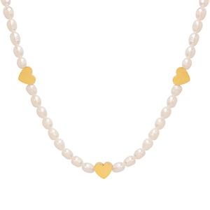 Baroque freshwater pearl necklace with three golden heart charms on a white background