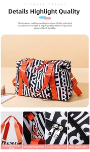 Close-up details of black and white printed travel bag with orange webbing handles