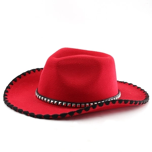 Detail of red wool felt cowboy hat with silver rivets and black whipstitched brim