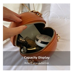 Internal view of brown basketball-shaped shoulder bag showing makeup storage capacity