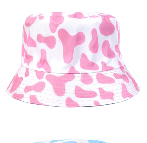 Detailed close-up of pink cow print bucket hat featuring high-quality cotton texture