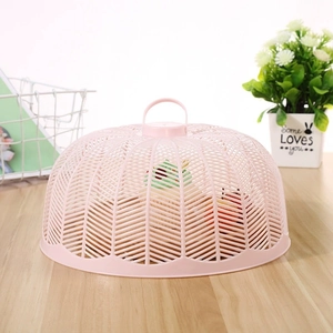 Pink round plastic food cover with handle for table protection against flies and dust