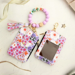 Floral print PU leather wallet set with purple silicone bead bracelet and tassel keychain