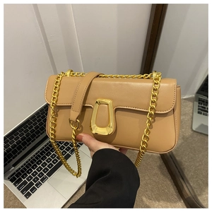 Detail of khaki leather shoulder bag with gold chain strap and geometric lock buckle