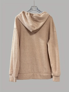 Detail view of the beige ribbed hooded sweatshirt fabric texture and back construction