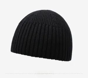 Detail view of the black ribbed knit beanie showing high-quality texture and stitching