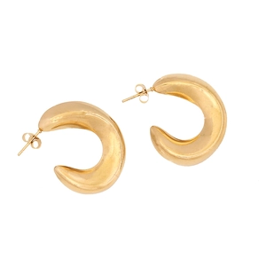 Close-up of gold geometric C-shaped stainless steel earrings with polished metal finish