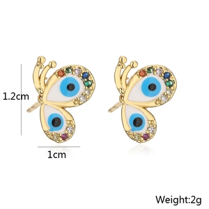 Detailed view of gold butterfly earrings with evil eye motif and colorful crystals