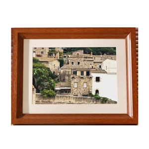 Classic mahogany wood photo frame with landscape art print and white decorative mat