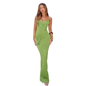Detail shot of green slim-fit maxi dress featuring abstract prints and knitted texture