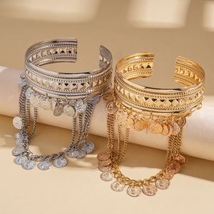 Bohemian gold and silver metal cuff armlets with fringed coins and embossed textures