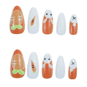 Long almond press-on nails with bright orange carrot and cute cartoon bunny designs
