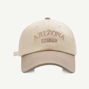 Detailed close-up of Arizona embroidery on a two-tone beige and khaki baseball cap