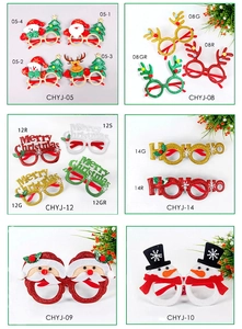 Detail of Christmas party glasses featuring Santa Claus, reindeer, and festive glitter motifs