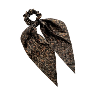 Leopard print scrunchie with long ribbons in brown satin fabric on white background