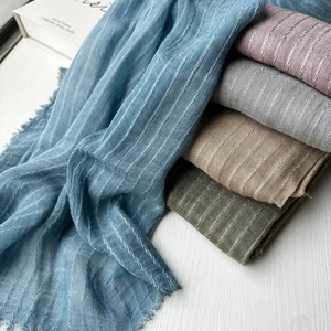 Elegant modal scarves with tassels in blue, pink, gray, beige, and green tones