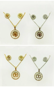 Detailed view of geometric crystal-inlaid necklace and earring sets in gold and silver finish