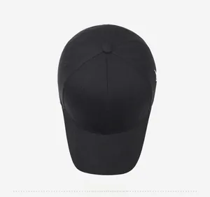 Top view of a black cotton baseball cap showing six-panel stitching and top button detail