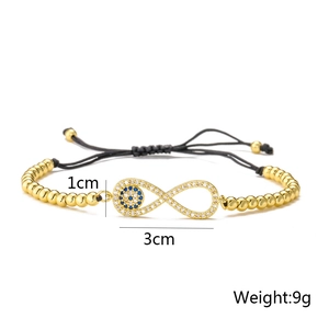 Detail view of 18K gold plated beaded bracelet with evil eye and infinity charm with dimensions