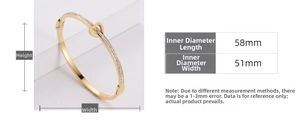 Detail view of gold titanium steel bangle with heart design and inlaid rhinestones