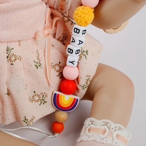Rainbow beech wood pacifier clip with crochet beads and silicone rainbow pendant