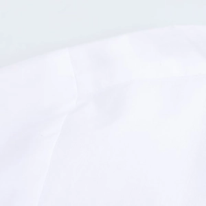 Close-up of white dress shirt fabric texture with professional stitching details