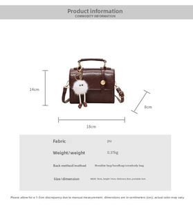 Detail of dark brown retro PU leather crossbody bag showing dimensions 18x14x8cm and pompom