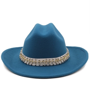 Detail of navy wool jazz hat featuring white band with silver studs and golden rhinestones