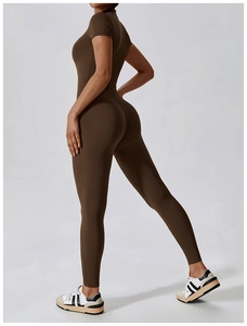 Side-back view of dark brown short-sleeve yoga bodysuit featuring a high-neck design