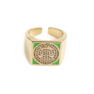 Macro detail of square gold ring with green enamel and brown crystal frowny face
